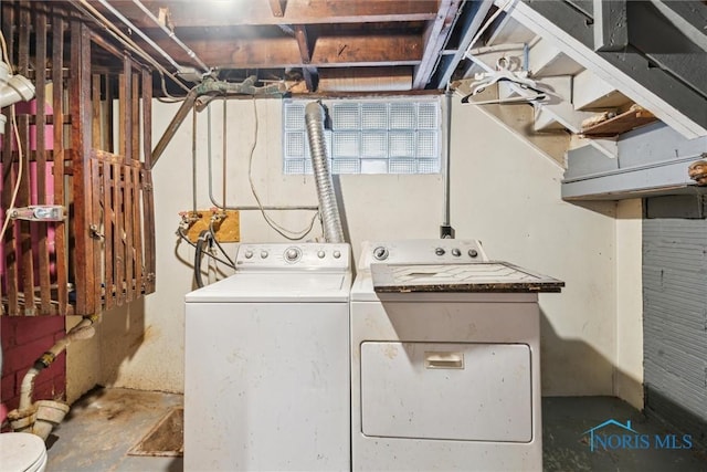 clothes washing area with separate washer and dryer