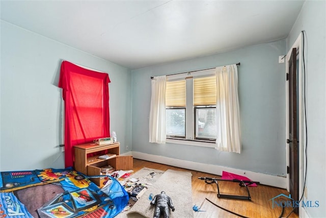 bedroom with hardwood / wood-style flooring