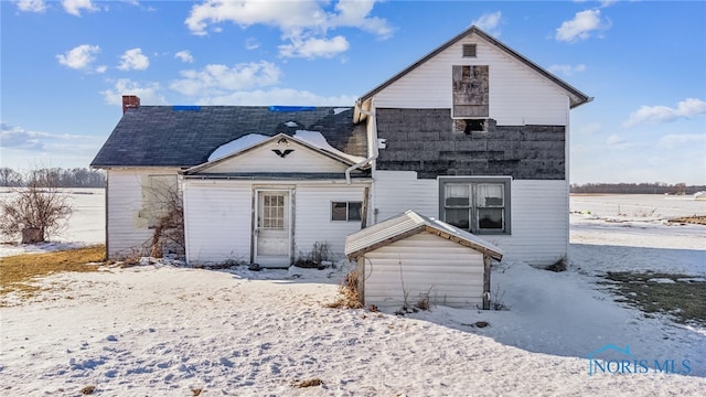 view of snow covered house