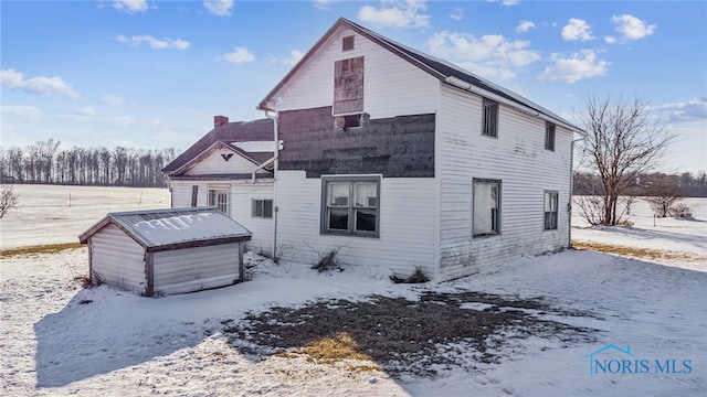 view of snow covered property