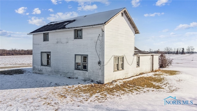 view of snow covered property