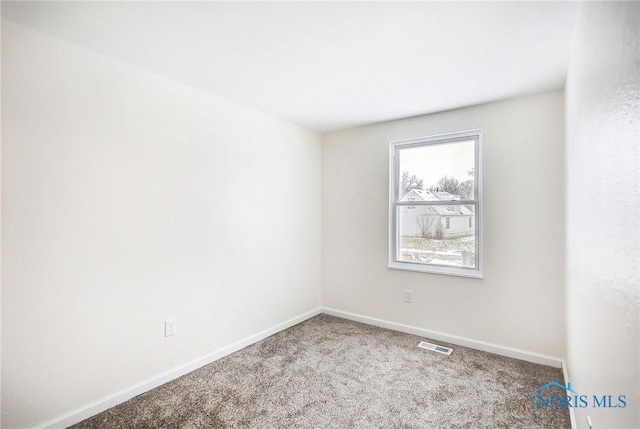 empty room featuring carpet flooring