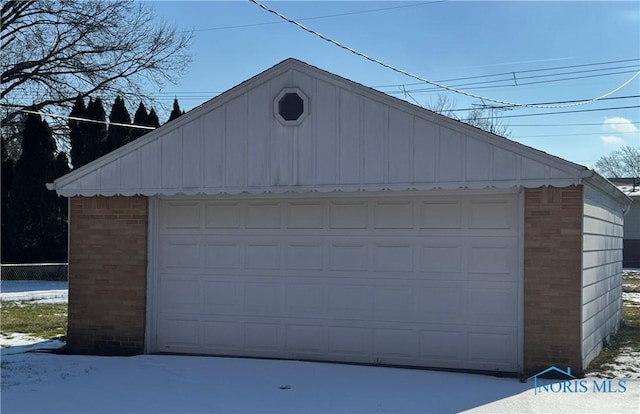 view of snow covered garage