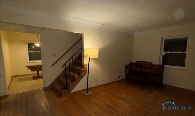 interior space featuring ornamental molding and hardwood / wood-style floors