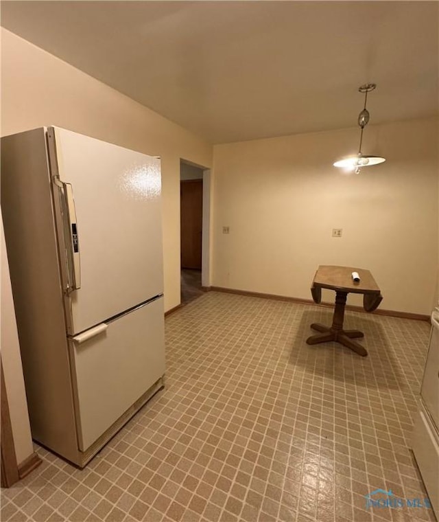 kitchen featuring white fridge