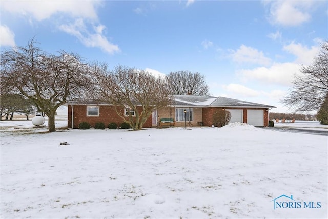 single story home featuring a garage