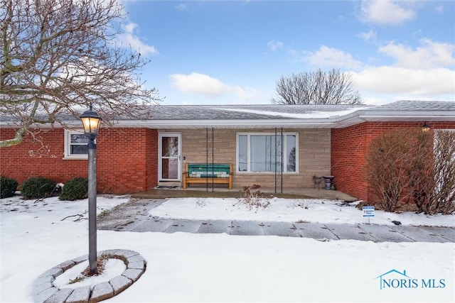 view of snow covered property