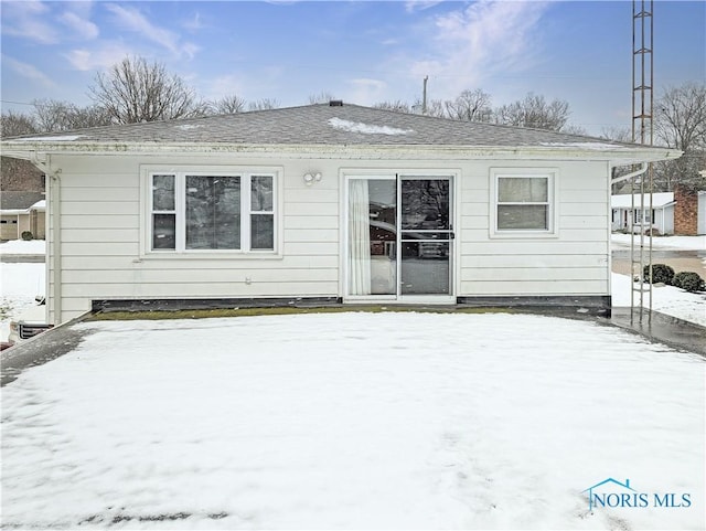 1318 E 4th St, Marblehead, OH 43440 - snow covered back of property with roof with shingles