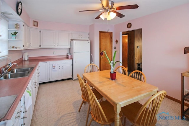 1318 E 4th St, Marblehead, OH 43440 - dining space with light floors and a ceiling fan