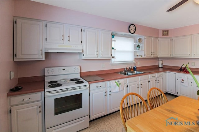 1318 E 4th St, Marblehead, OH 43440 - kitchen featuring white cabinets, a sink, a ceiling fan, under cabinet range hood, and white electric range