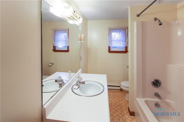 1318 E 4th St, Marblehead, OH 43440 - full bathroom with vanity, tile patterned floors, a baseboard heating unit, toilet, and bathing tub / shower combination