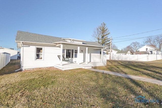 view of front of house featuring a front yard and a porch