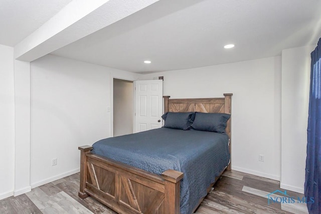 bedroom with wood-type flooring