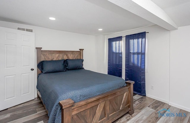 bedroom featuring dark wood-type flooring