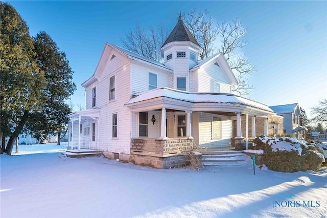 victorian home featuring covered porch