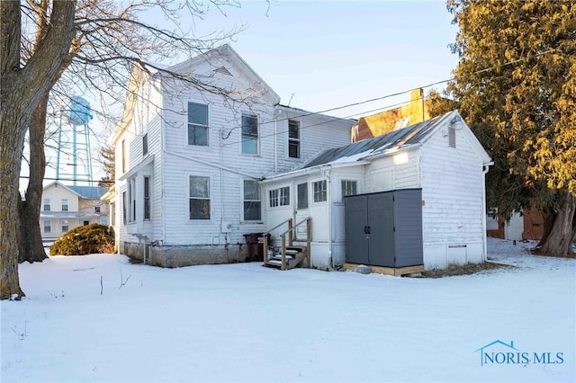 view of snow covered property