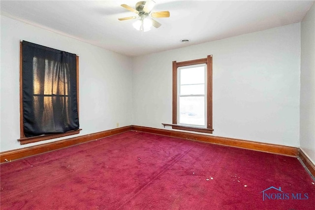 unfurnished room featuring carpet floors and ceiling fan