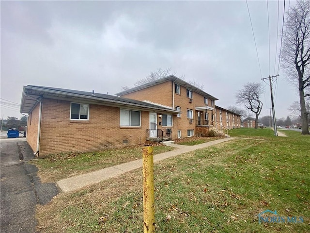 exterior space with a front yard