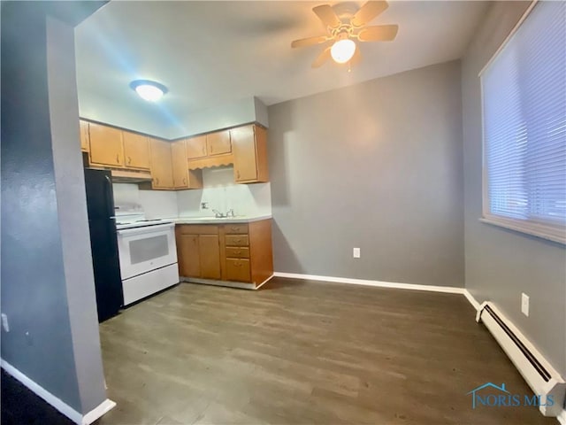 kitchen with black refrigerator, a baseboard heating unit, ceiling fan, light brown cabinets, and white range with electric cooktop