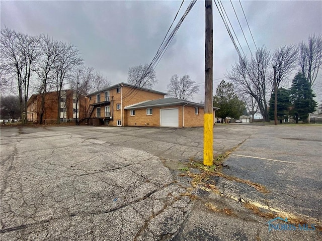 view of side of property with a garage