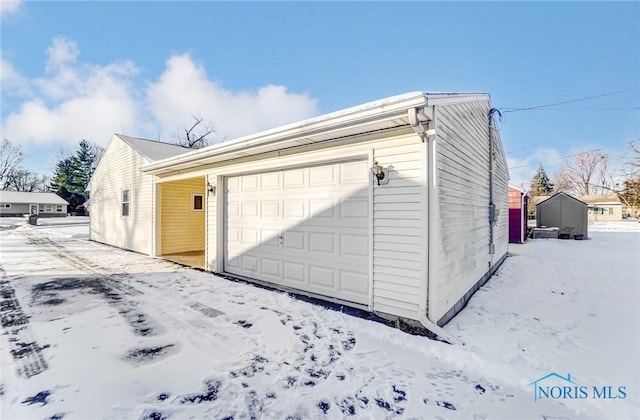 view of snow covered garage