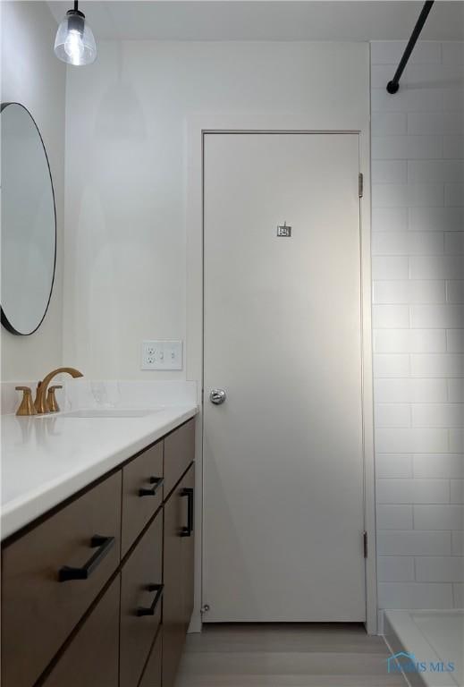 bathroom with vanity and walk in shower