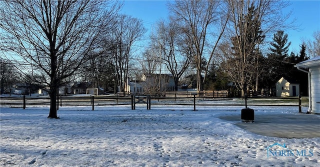 view of yard layered in snow