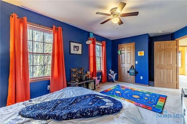 carpeted bedroom with ceiling fan