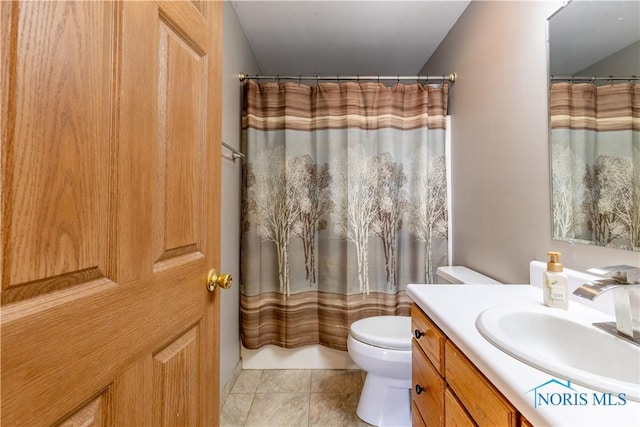 bathroom with vanity, a shower with curtain, tile patterned floors, and toilet