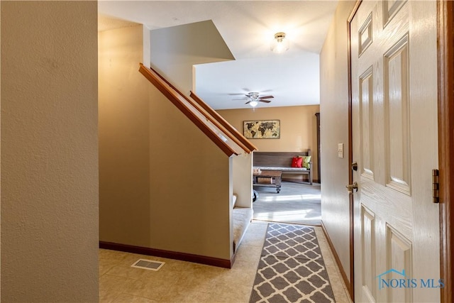 entrance foyer featuring ceiling fan