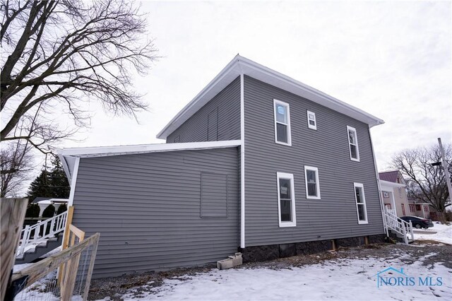 view of snow covered property