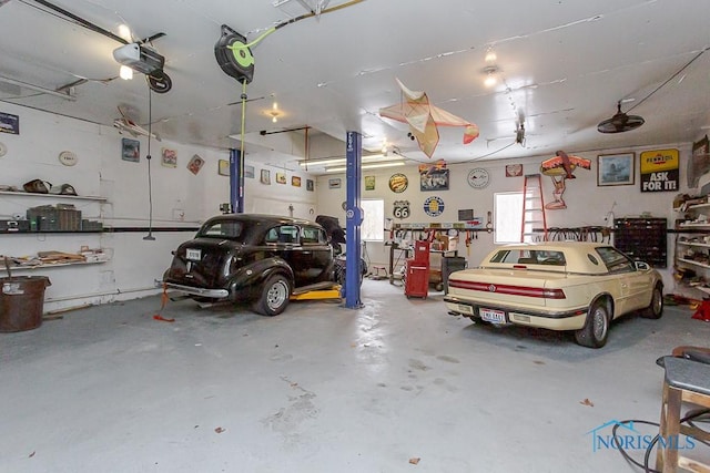 garage with a garage door opener and a workshop area