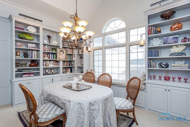 dining room with light carpet, an inviting chandelier, and high vaulted ceiling