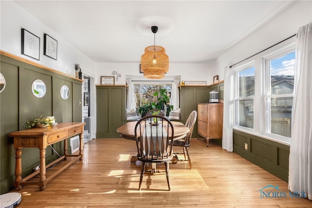 dining space with light wood-type flooring