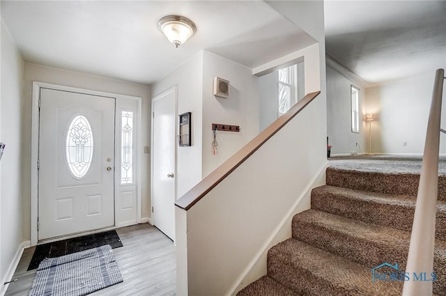 foyer entrance with light wood-type flooring