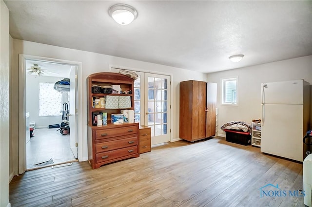 misc room featuring french doors and light hardwood / wood-style floors