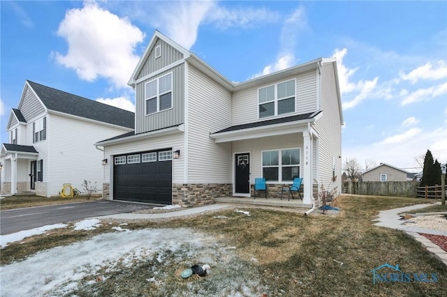 view of front of property with a porch and a garage