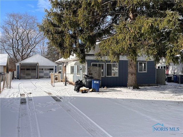 view of front of property with an outbuilding and a garage