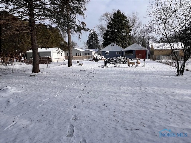 view of yard covered in snow