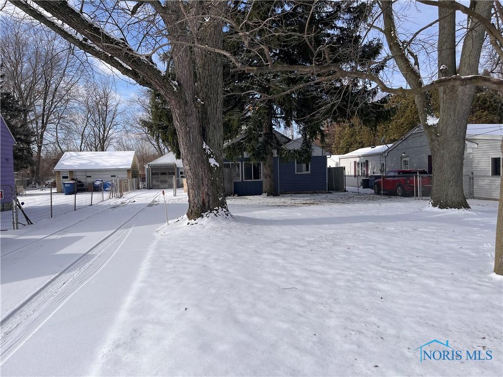 view of yard covered in snow