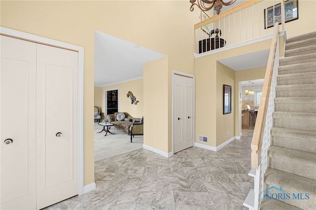 entryway with a chandelier