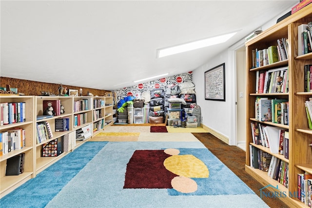 rec room with dark colored carpet