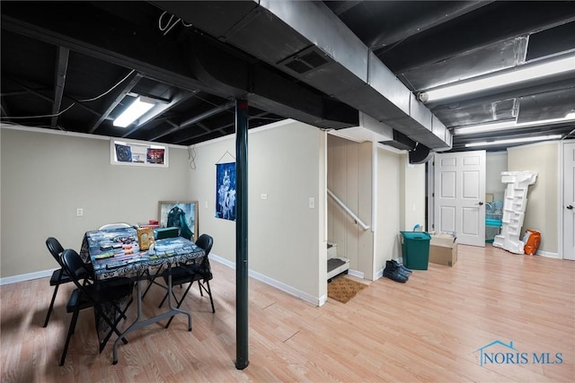 basement with hardwood / wood-style floors