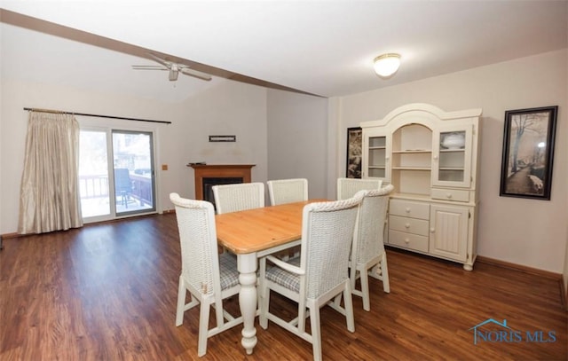 dining space with dark hardwood / wood-style flooring and ceiling fan