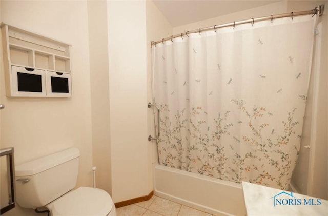 bathroom featuring shower / bath combo, tile patterned floors, and toilet