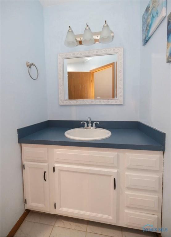 bathroom with vanity and tile patterned floors