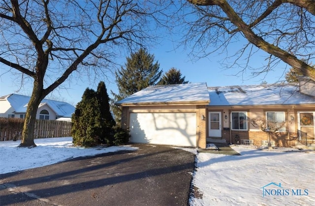 single story home with a garage