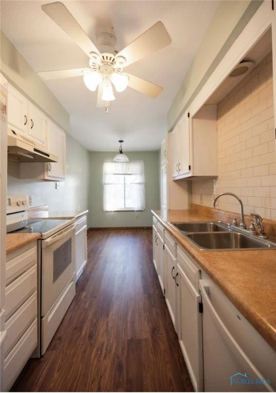 kitchen featuring dishwasher, sink, white cabinets, white electric range oven, and dark wood-type flooring