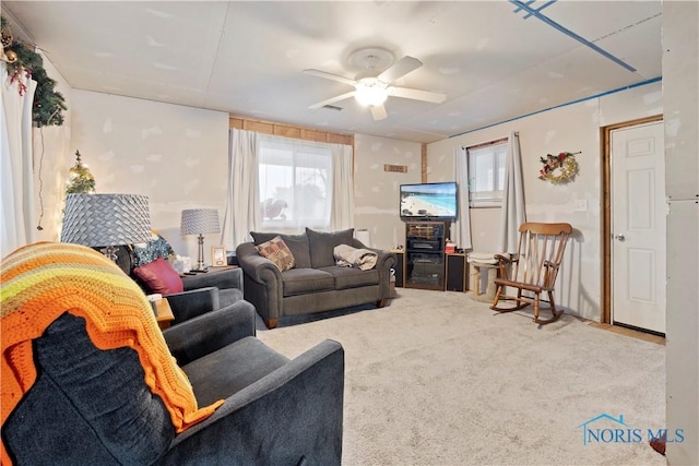 living room featuring ceiling fan and carpet flooring