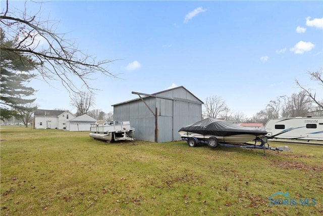 view of outbuilding with a lawn